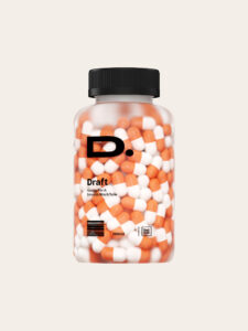 Capsule jar with orange and white pills